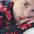 portrait of zaccy wearing black and red
