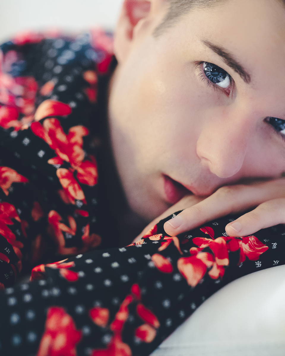 portrait of zaccy wearing black and red